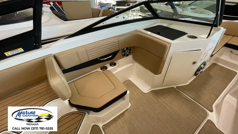 Slide: The Image of 2023 Sea Ray SPX 190 boat interior with tan seating and modern design. - 8