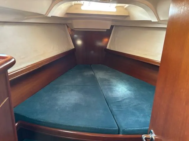 Slide: The Image of Interior cabin of 1998 Beneteau 381 sailboat with cozy sleeping area. - 44