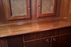 Slide: The Image of Wooden interior of a 1998 Beneteau 381 yacht with cabinets and woven paneling. - 46