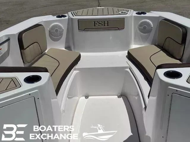 Slide: The Image of 2025 Yamaha Boats 222 FSH Sport interior with cushioned seating and cup holders. - 8