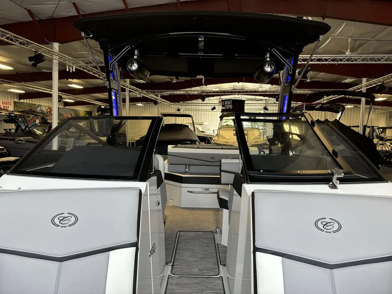 Slide: The Image of 2025 Cobalt R4 Surf boat interior at a boat expo showroom. - 10