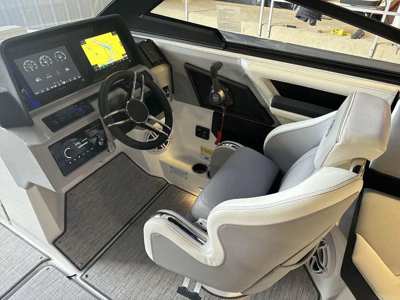 Slide: The Image of 2025 Cobalt R4 Surf boat cockpit with modern steering and navigation displays. - 11