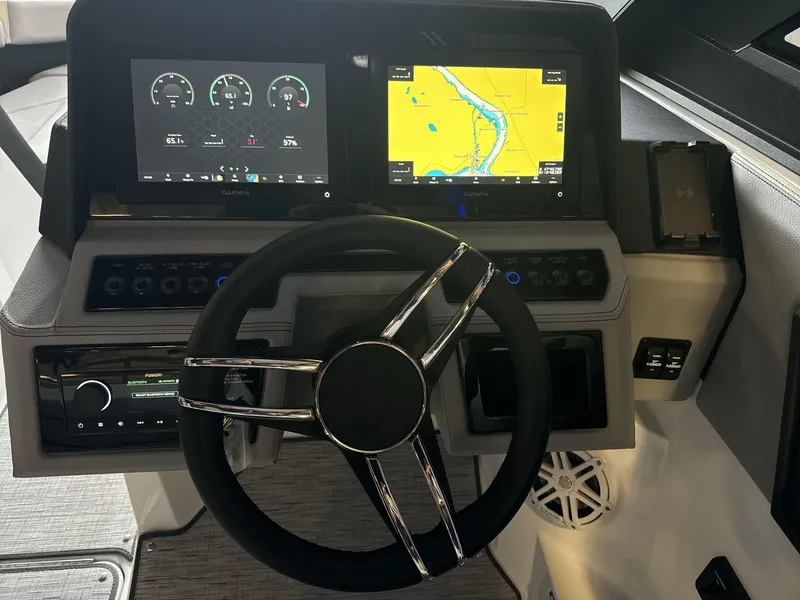 Slide: The Image of 2025 Cobalt R4 Surf dashboard with Garmin navigation and control displays. - 12