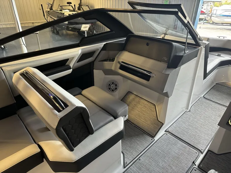 Slide: The Image of 2025 Cobalt R4 Surf boat interior with modern seating and sleek design. - 13