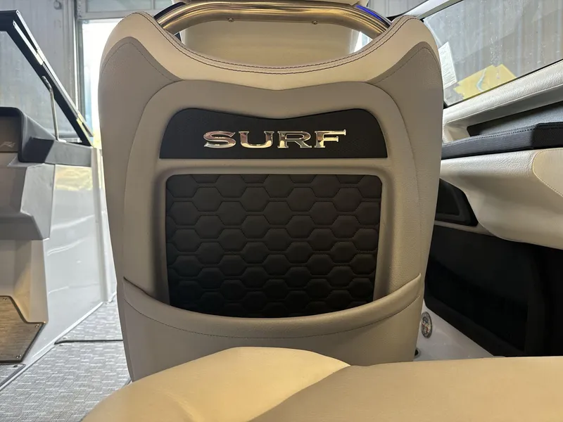 Slide: The Image of 2025 Cobalt R4 Surf boat seat with hexagonal pattern and "Surf" logo. - 17