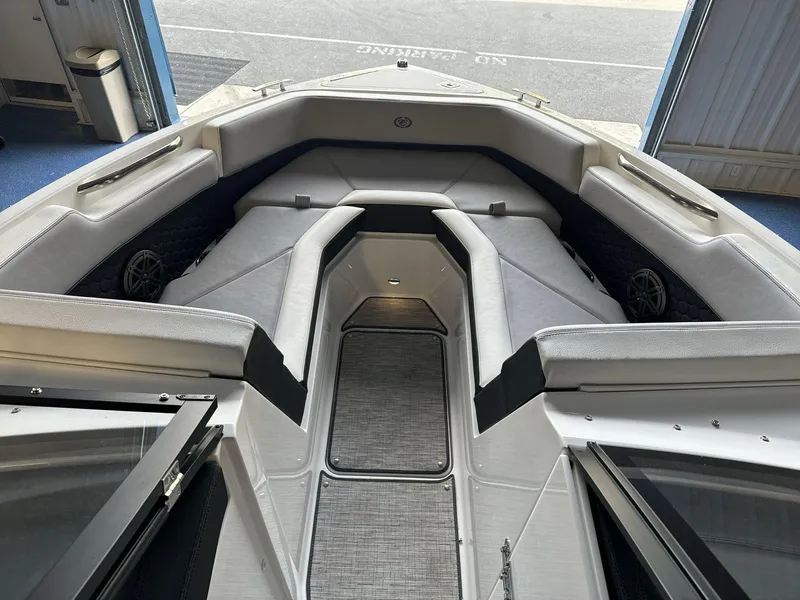 Slide: The Image of 2025 Cobalt R4 Surf boat interior with spacious seating and modern design. - 9