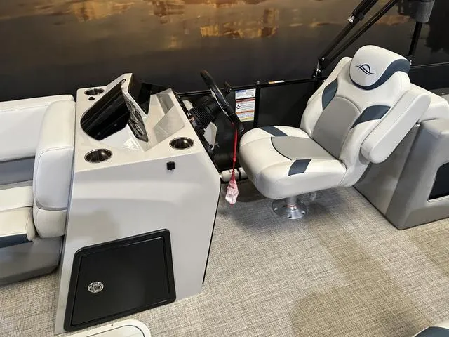 Slide: The Image of 2025 G3 Suncatcher Select 322SS boat interior with Yamaha 250HP, featuring steering console and seating. - 10