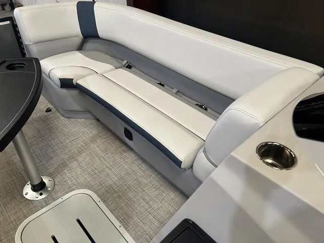 Slide: The Image of 2025 G3 Suncatcher Select 322SS boat dashboard with steering wheel and control panel. - 11