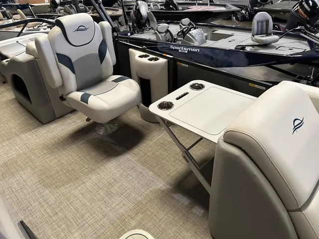 Slide: The Image of 2025 G3 Suncatcher Select 322SS boat interior with plush seating and modern design. - 13