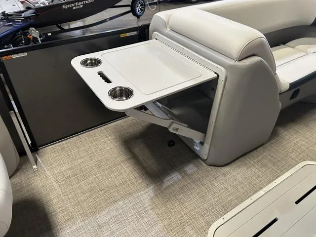 Slide: The Image of 2025 G3 Suncatcher Select 322SS boat interior with seating and table. - 14