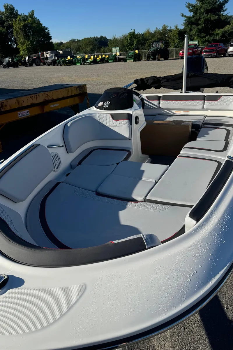 Slide: The Image of 2025 Bayliner 15E boat interior with cushioned seating and modern design. - 6