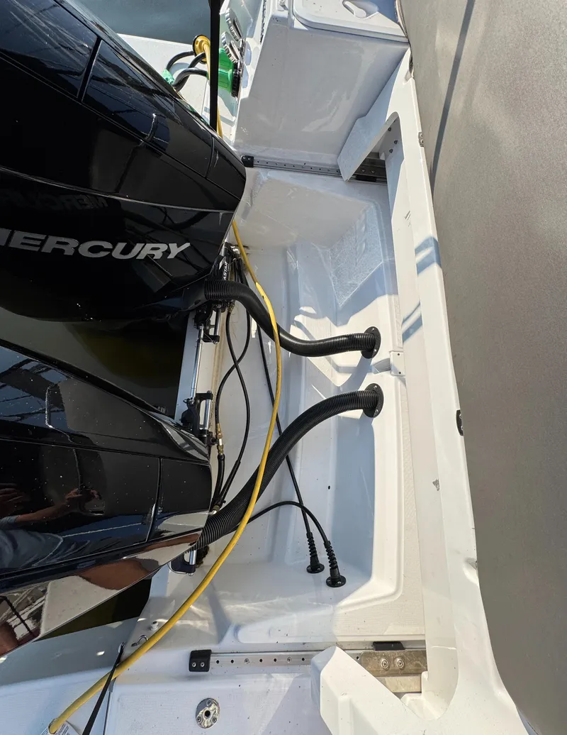 Slide: The Image of 2023 Beneteau Antares 9 boat with dual Mercury outboard engines. - 16