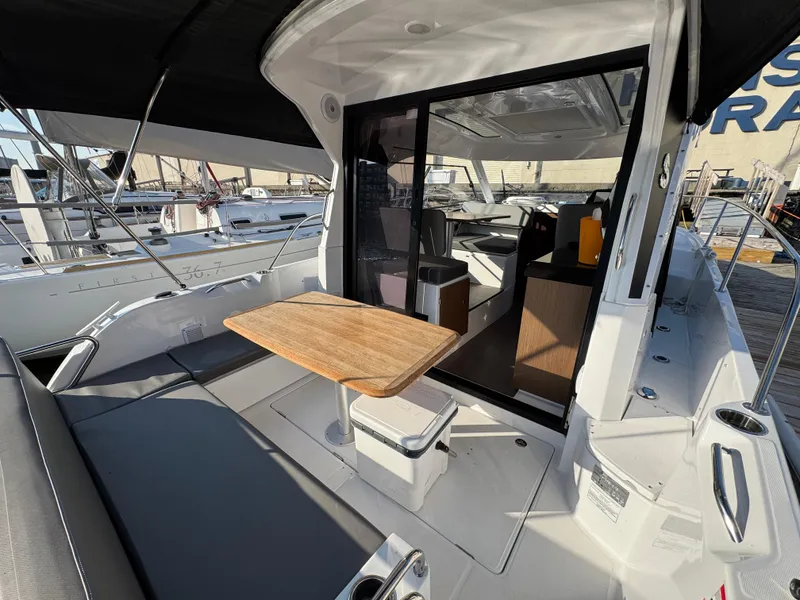 Slide: The Image of 2023 Beneteau Antares 9 boat with spacious deck and modern interior design. - 23