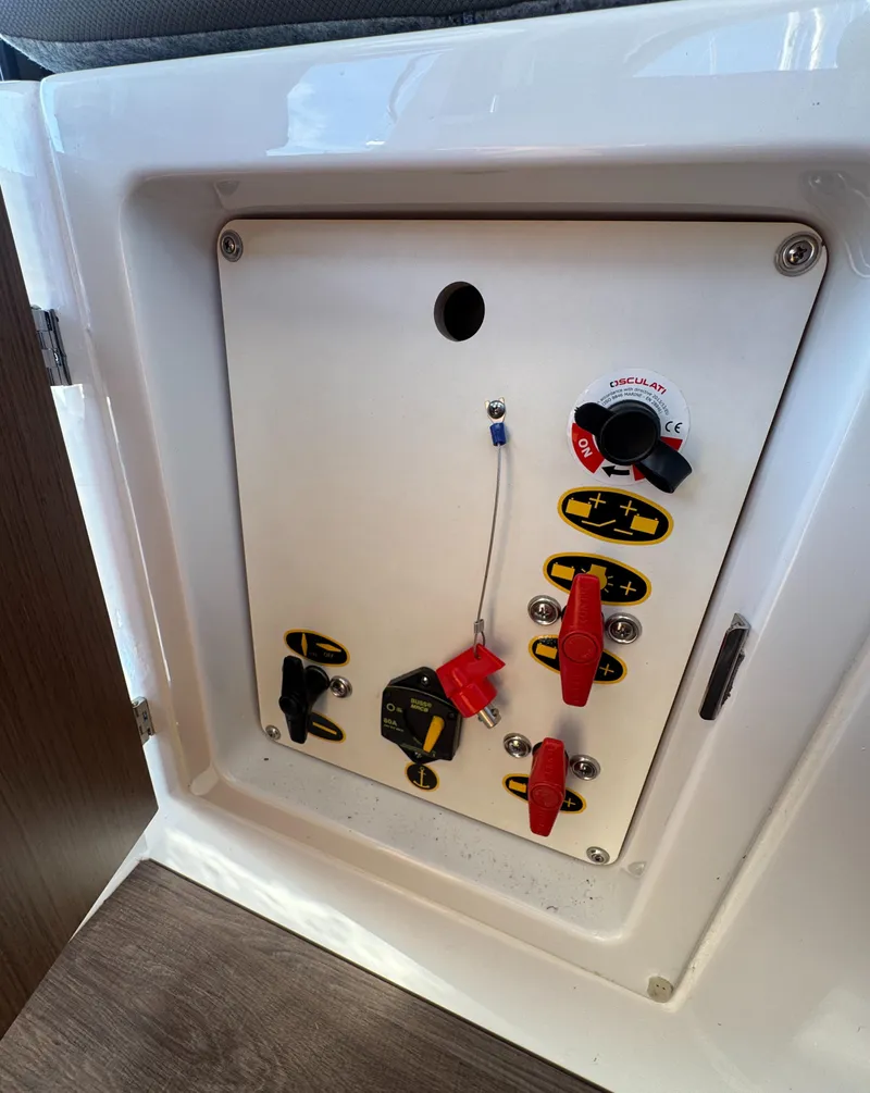 Slide: The Image of Control panel of 2023 Beneteau Antares 9 boat with switches and dials. - 31