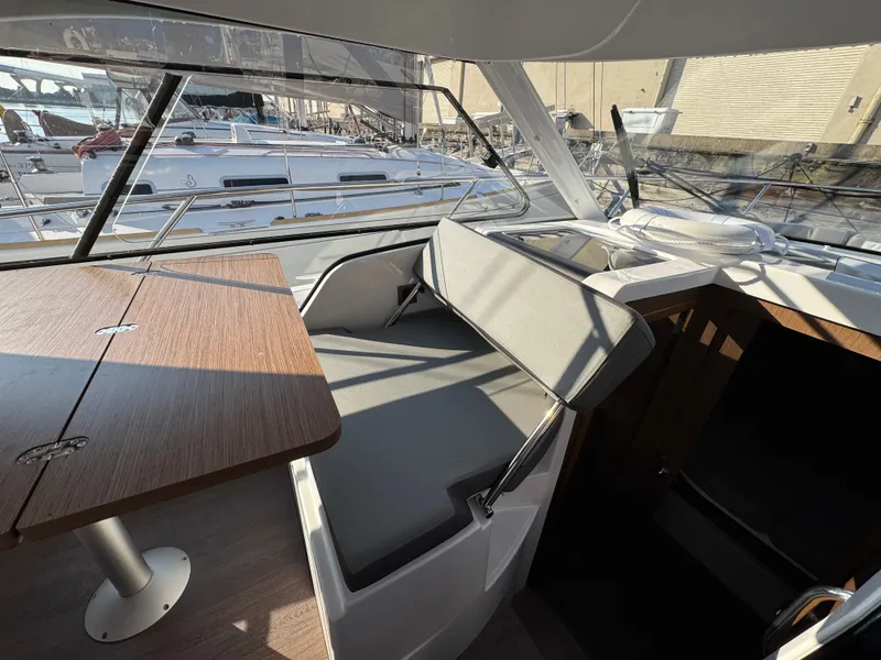 Slide: The Image of Interior of 2023 Beneteau Antares 9 with seating and table, showcasing modern design. - 34