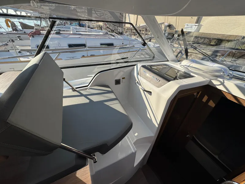 Slide: The Image of Interior view of 2023 Beneteau Antares 9 boat, featuring sleek seating and modern design. - 36