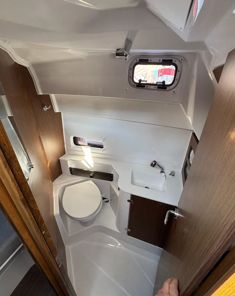 Slide: The Image of 2023 Beneteau Antares 9 boat bathroom interior with modern fixtures and compact design. - 46