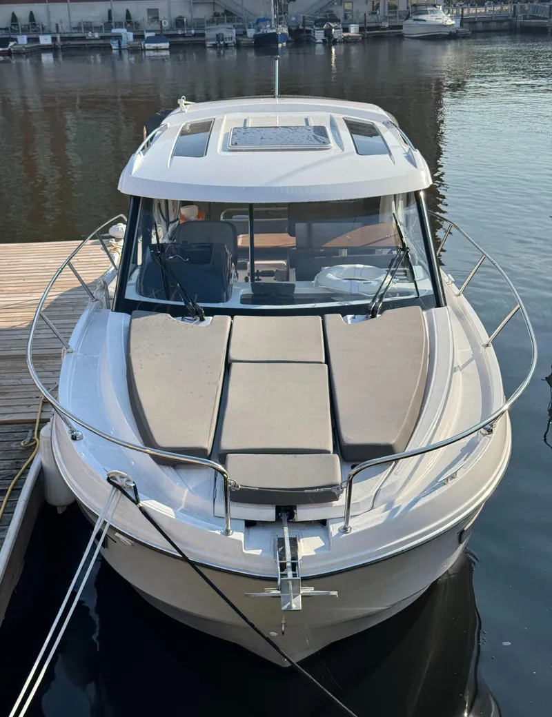 Slide: The Image of 2023 Beneteau Antares 9 boat docked at marina, front view. - 6