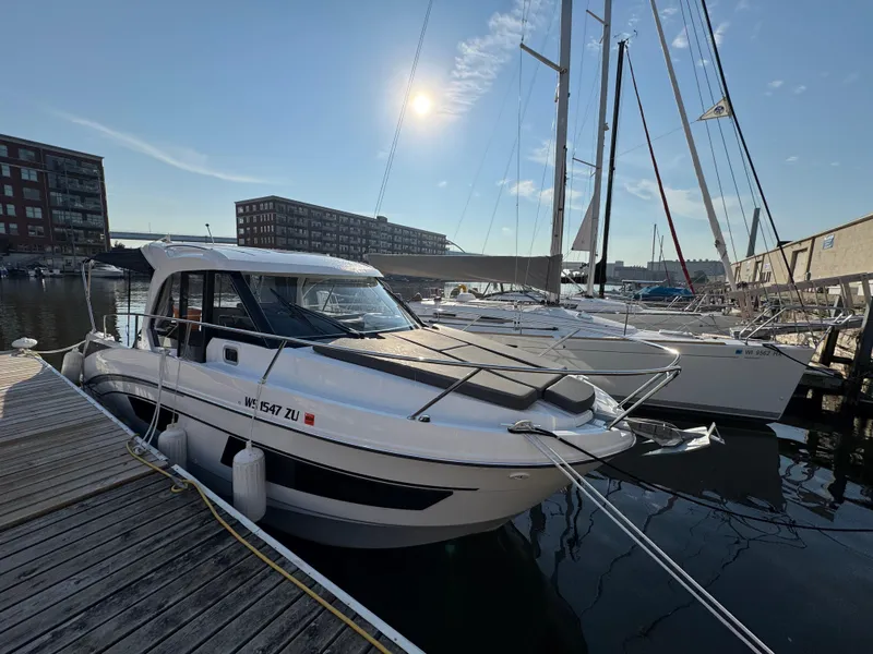 Slide: The Image of 2023 Beneteau Antares 9 docked at marina under sunny sky. - 7