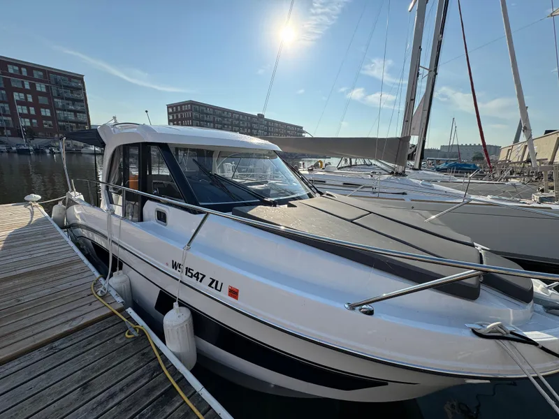 Slide: The Image of 2023 Beneteau Antares 9 docked in a sunny marina. - 8