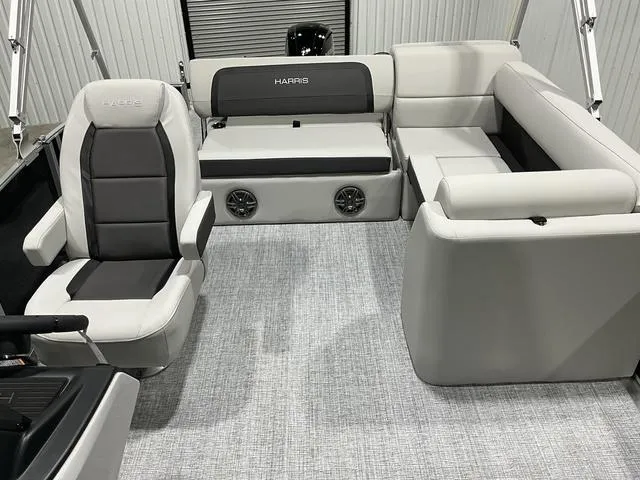 Slide: The Image of 2025 Harris Cruiser 210 SL interior with gray seating and modern design. - 13