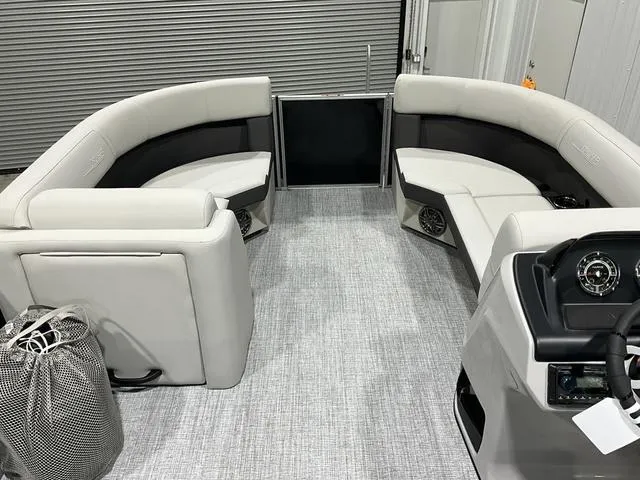 Slide: The Image of 2025 Harris Cruiser 210 SL interior with plush seating and modern dashboard. - 14