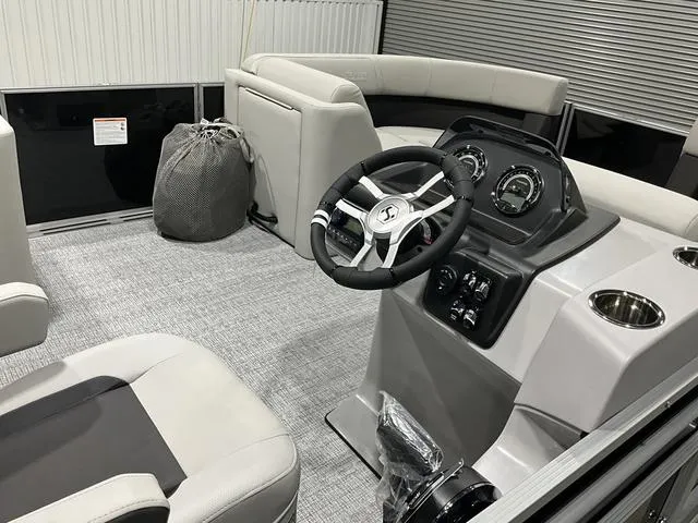 Slide: The Image of 2025 Harris Cruiser 210 SL interior with modern steering and seating. - 9