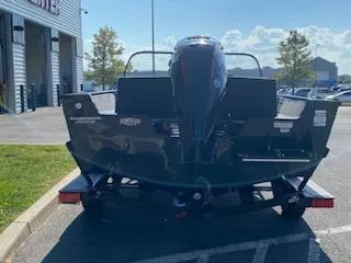 Slide: The Image of 2025 Tracker Pro Guide V-175 Combo boat on trailer, rear view in parking lot. - 14