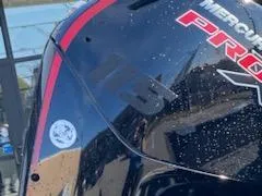 Slide: The Image of Close-up of 2025 Tracker Pro Guide V-175 Combo boat with Mercury Pro branding. - 15