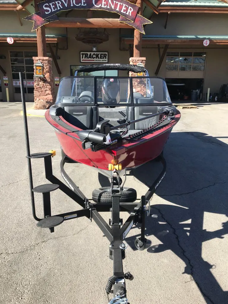 Slide: The Image of 2025 Tracker Targa V-18 Combo boat on trailer at service center. - 3