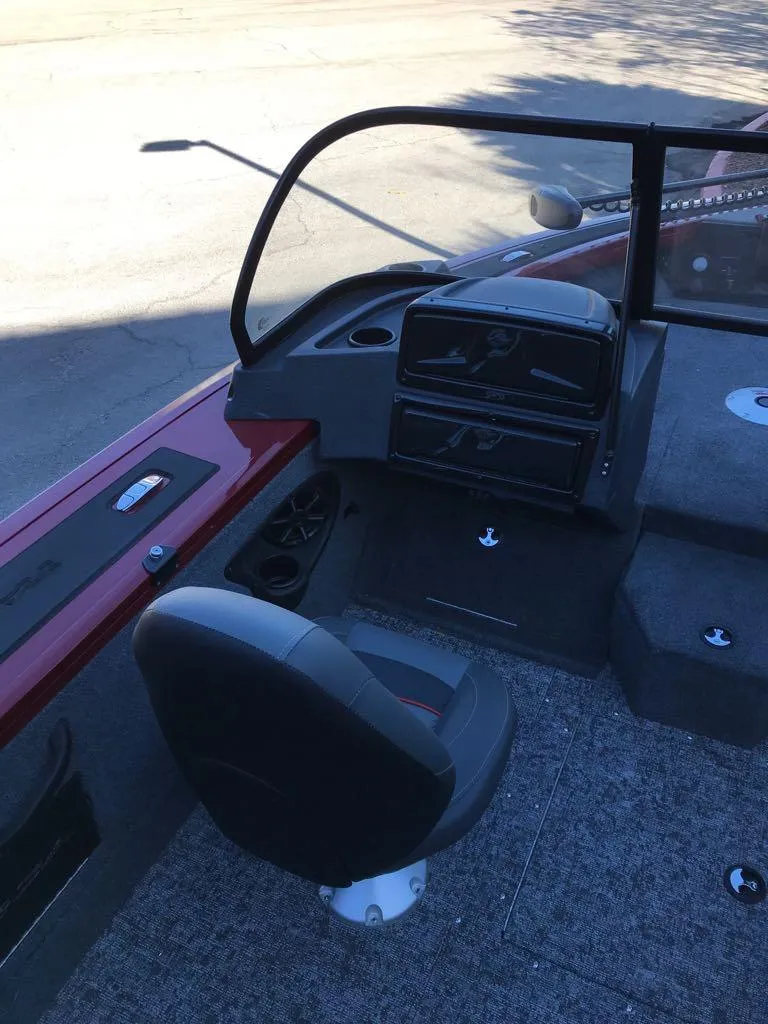 Slide: The Image of 2025 Tracker Targa V-18 Combo boat interior with steering console and seating. - 6