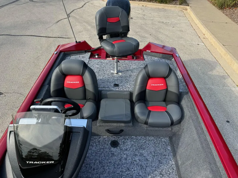 Slide: The Image of 2025 Tracker Pro Team 175 boat interior with gray and red seating. - 4