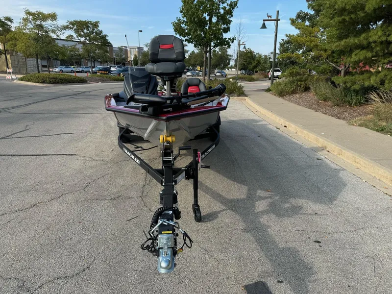 Slide: The Image of 2025 Tracker Pro Team 175 boat on trailer in parking lot. - 5