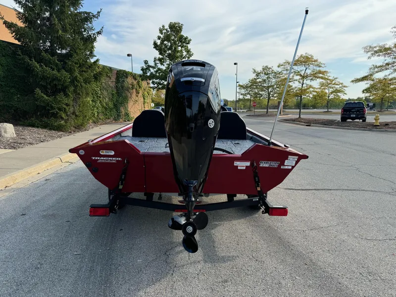 Slide: The Image of 2025 Tracker Pro Team 175 boat, rear view, parked on pavement. - 6