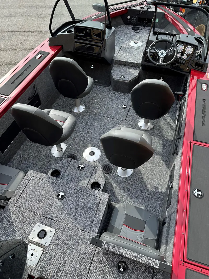 Slide: The Image of 2025 Tracker Targa V-18 Combo boat interior with four seats and modern dashboard. - 3