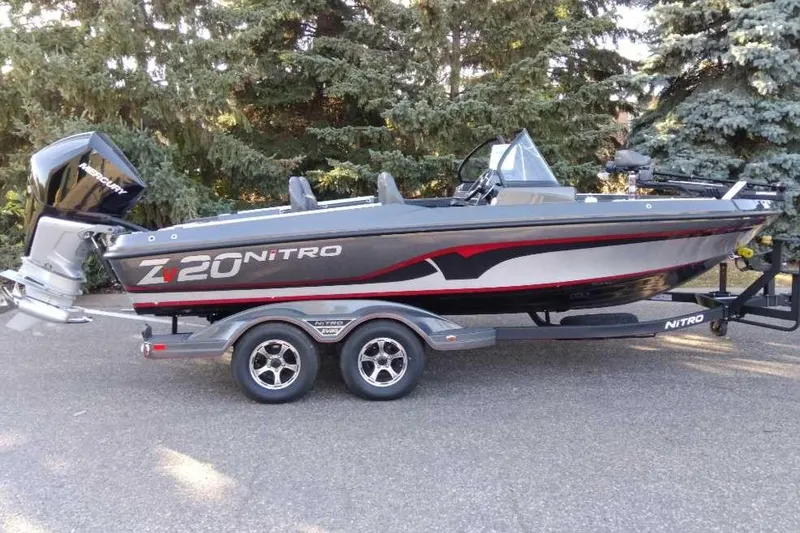 The Image of 2024 Nitro ZV20 Pro fishing boat on trailer, parked outdoors. - 0