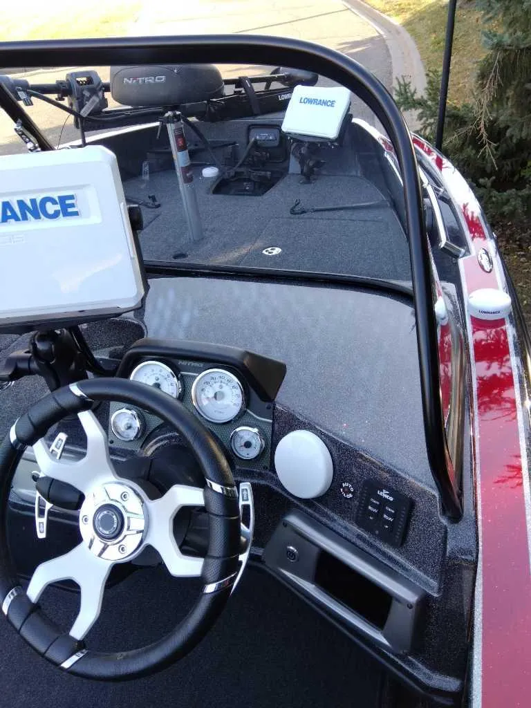 Slide: The Image of 2024 Nitro ZV20 Pro boat dashboard with steering wheel and navigation equipment. - 10