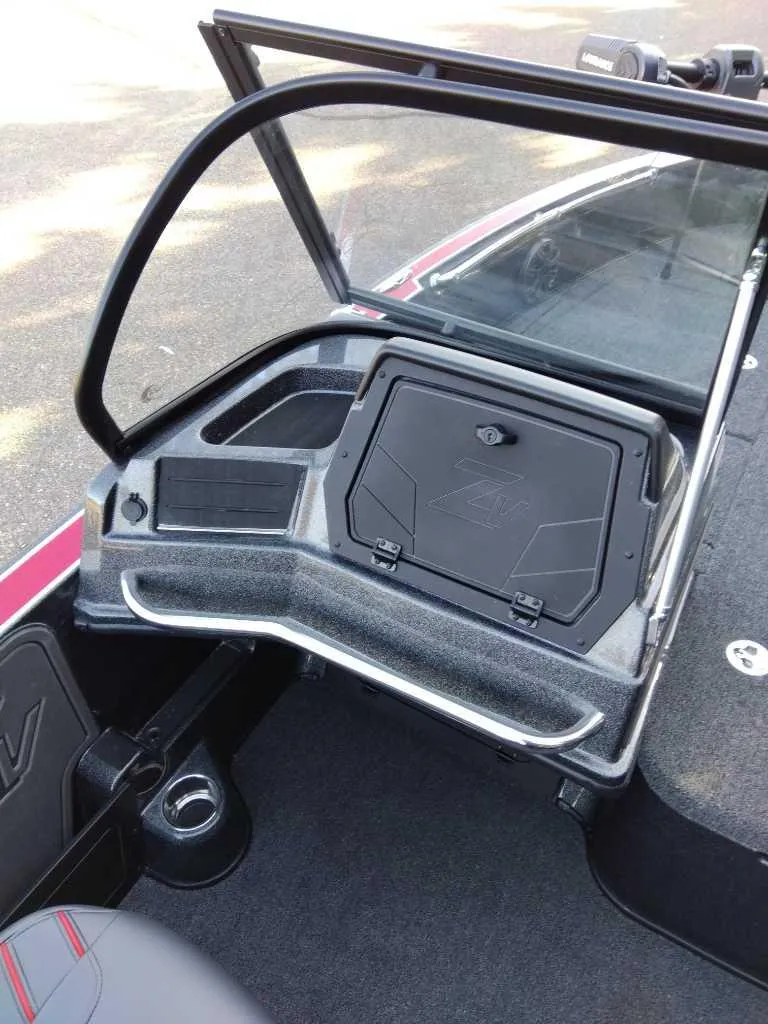 Slide: The Image of 2024 Nitro ZV20 Pro boat interior with storage compartment and windshield. - 11