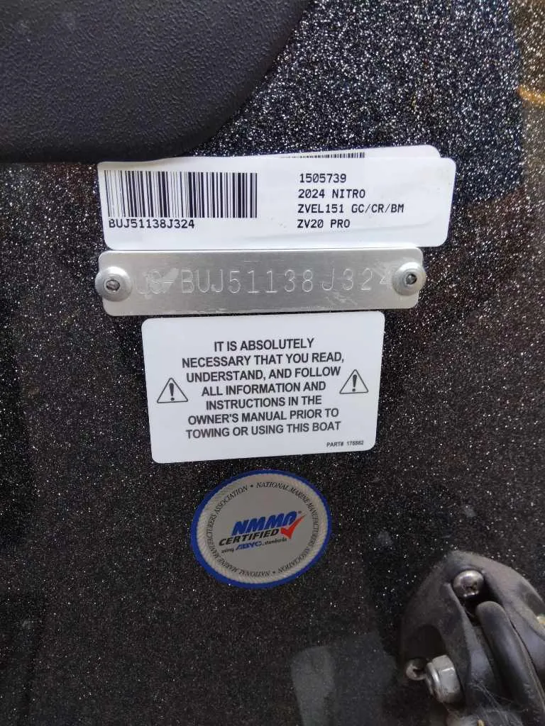Slide: The Image of 2024 Nitro ZV20 Pro boat identification and safety instructions label. - 14