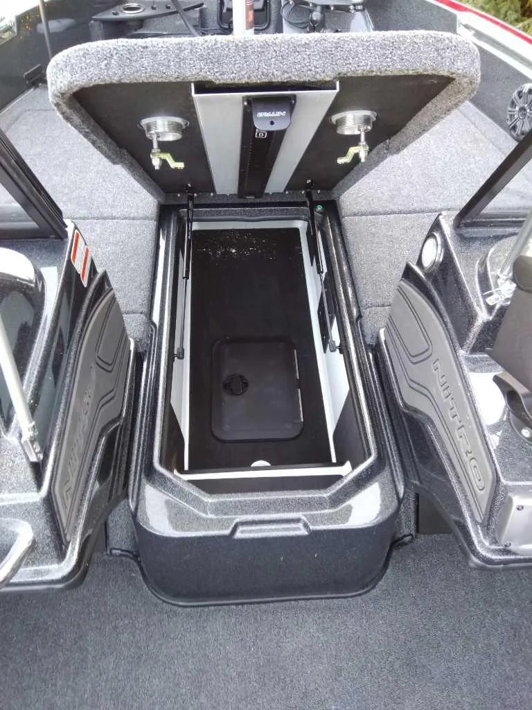 Slide: The Image of 2024 Nitro ZV20 Pro boat storage compartment with open lid, showcasing interior space. - 7