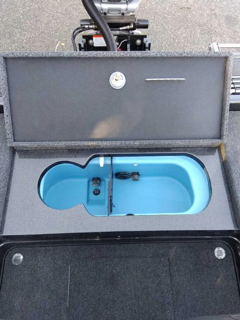 Slide: The Image of 2024 Nitro ZV20 Pro boat livewell with open lid, showcasing interior design. - 8