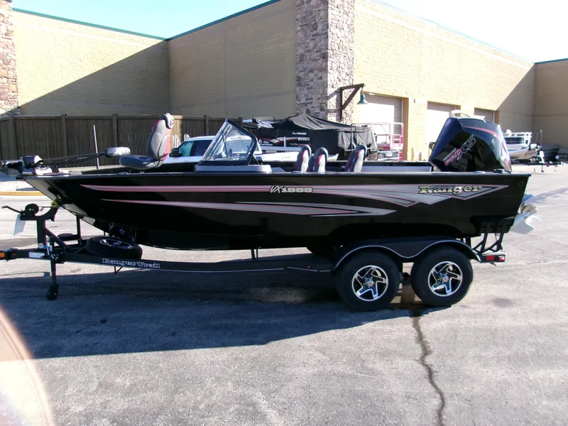 Slide: The Image of 2024 Ranger VX1888 WT boat on trailer, parked outdoors. - 2