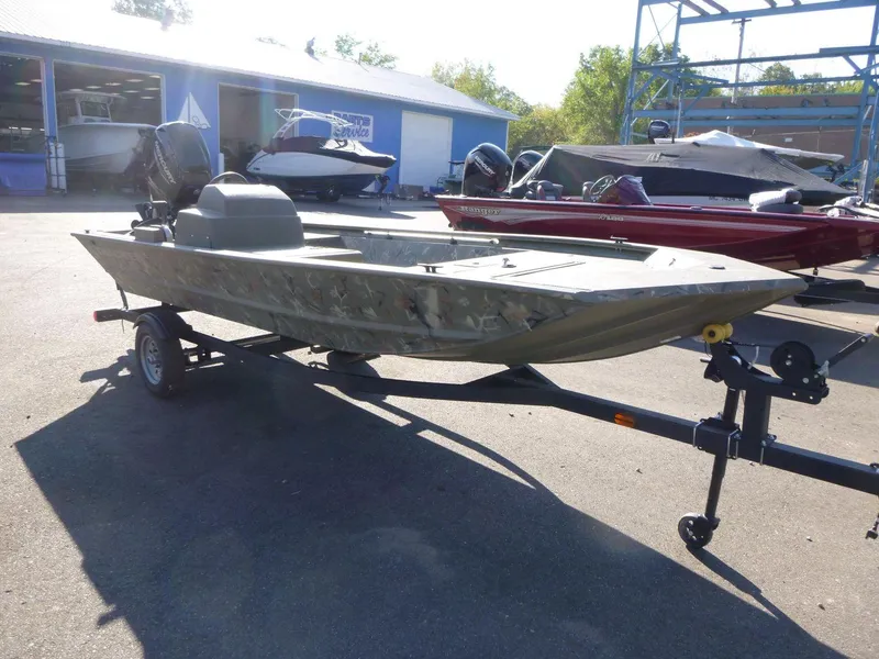 The Image of 2024 Tracker Grizzly 1648 SC boat on trailer in outdoor showroom. - 0