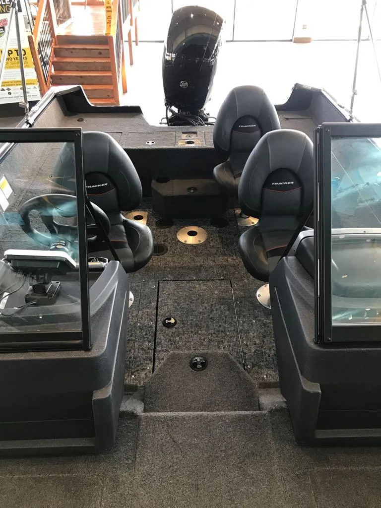 Slide: The Image of 2025 Tracker Pro Guide V-175 WT boat interior with seating and console. - 10