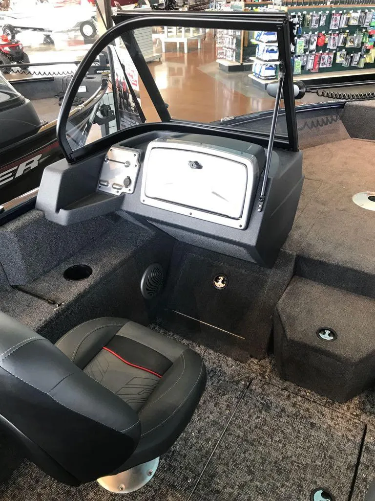 Slide: The Image of 2025 Tracker Pro Guide V-175 WT boat interior with steering console and seating. - 7