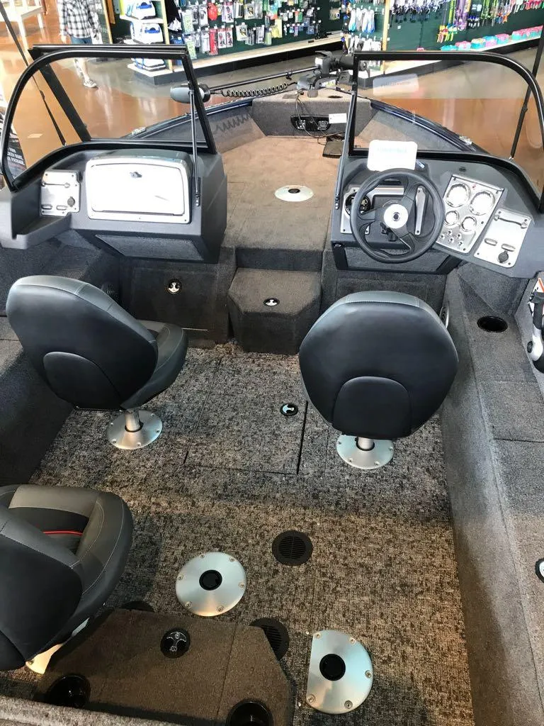 Slide: The Image of 2025 Tracker Pro Guide V-175 WT boat interior with dual seats and control panel. - 8