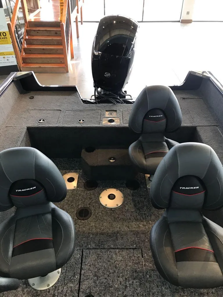 Slide: The Image of 2025 Tracker Pro Guide V-175 WT boat interior with seating and motor. - 9