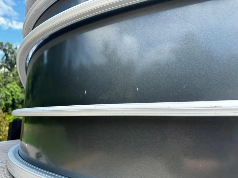 Slide: The Image of Close-up of 2023 Sun Tracker Party Barge 22 DLX exterior with metallic finish. - 10