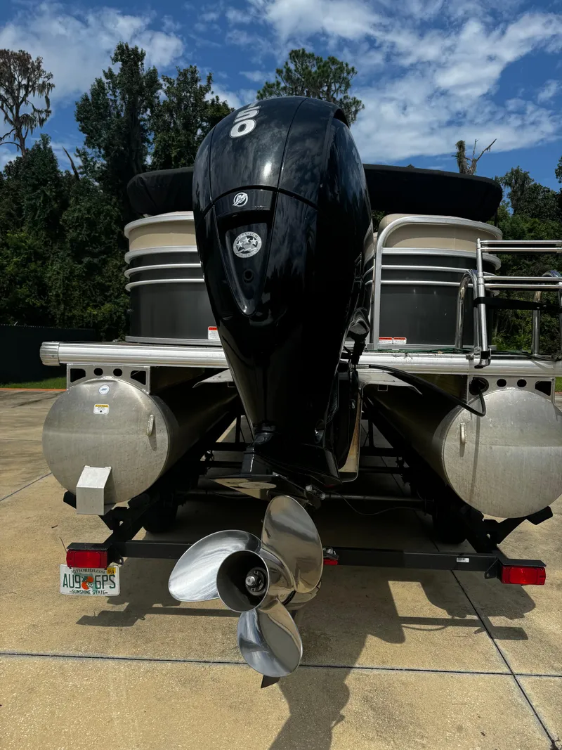 Slide: The Image of 2023 Sun Tracker Party Barge 22 DLX pontoon boat with powerful outboard motor. - 14