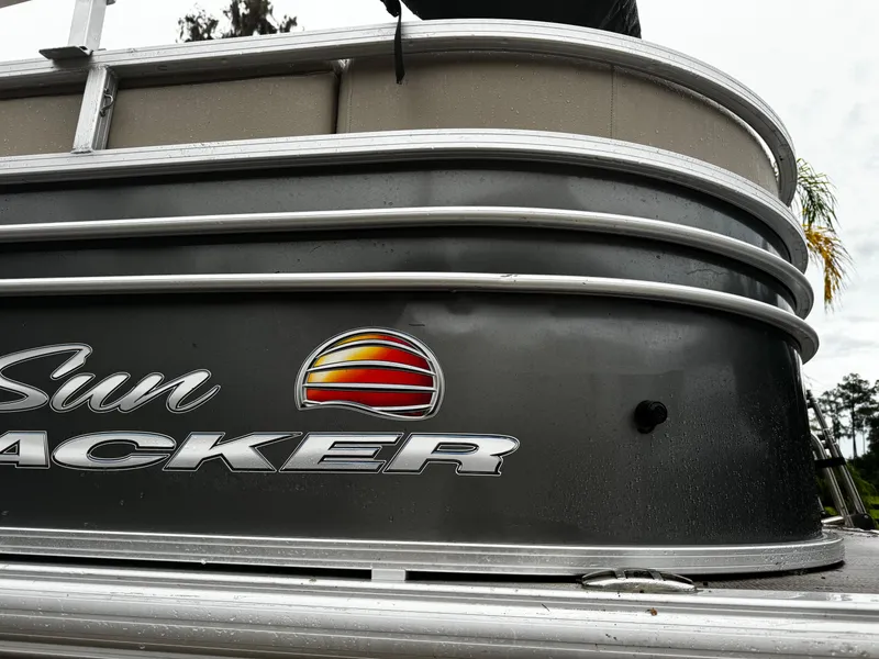 Slide: The Image of 2023 Sun Tracker Party Barge 22 DLX pontoon boat, side view with logo. - 18